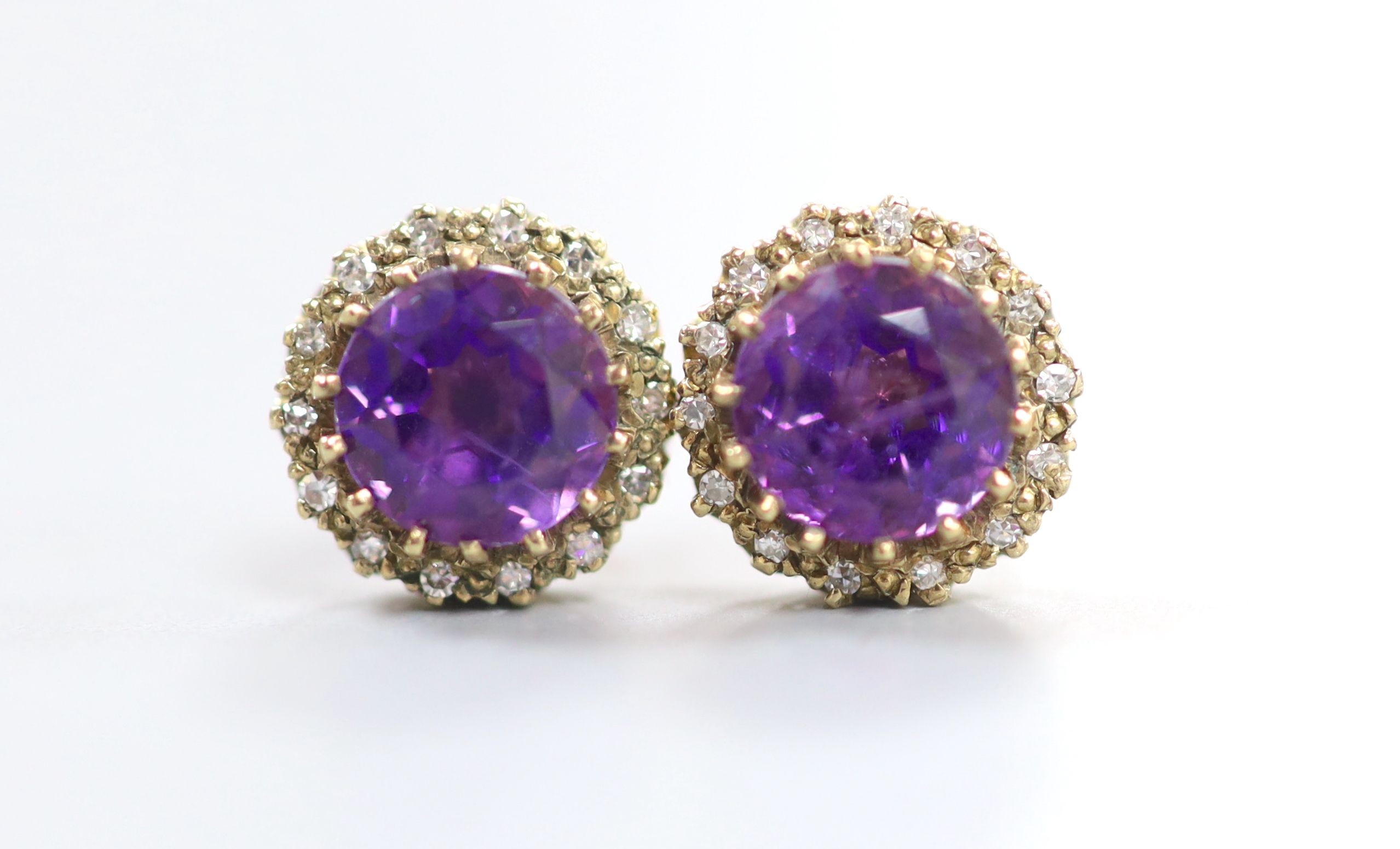 A pair of 9ct gold, amethyst and diamond chip set circular cluster ear studs (lacking butterflies), 10mm, gross weight 2.9 grams.